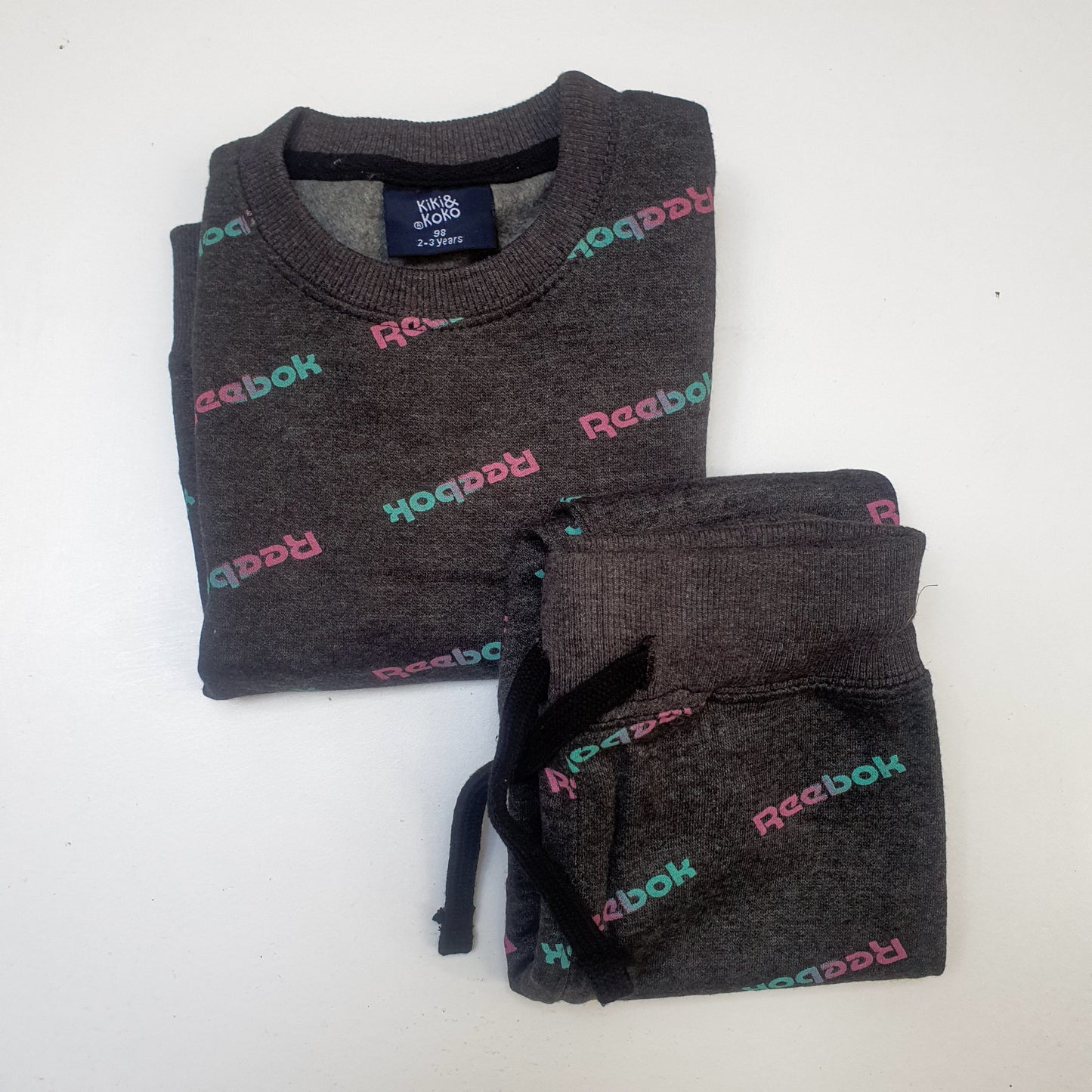 Reebok text print dark grey tracksuit Unisex