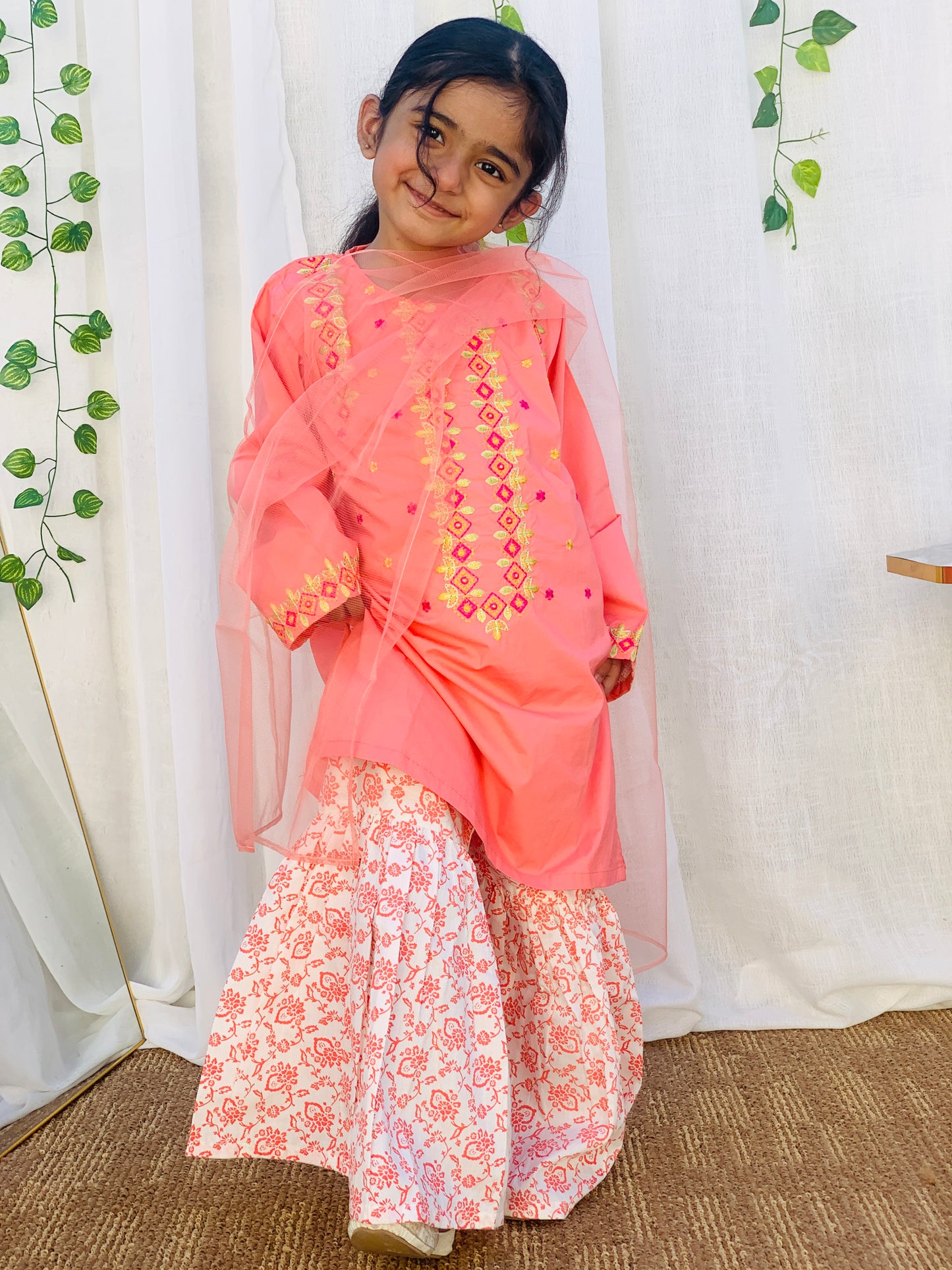 A Qaswa Embroided Orange cotton gharara 3pc dress