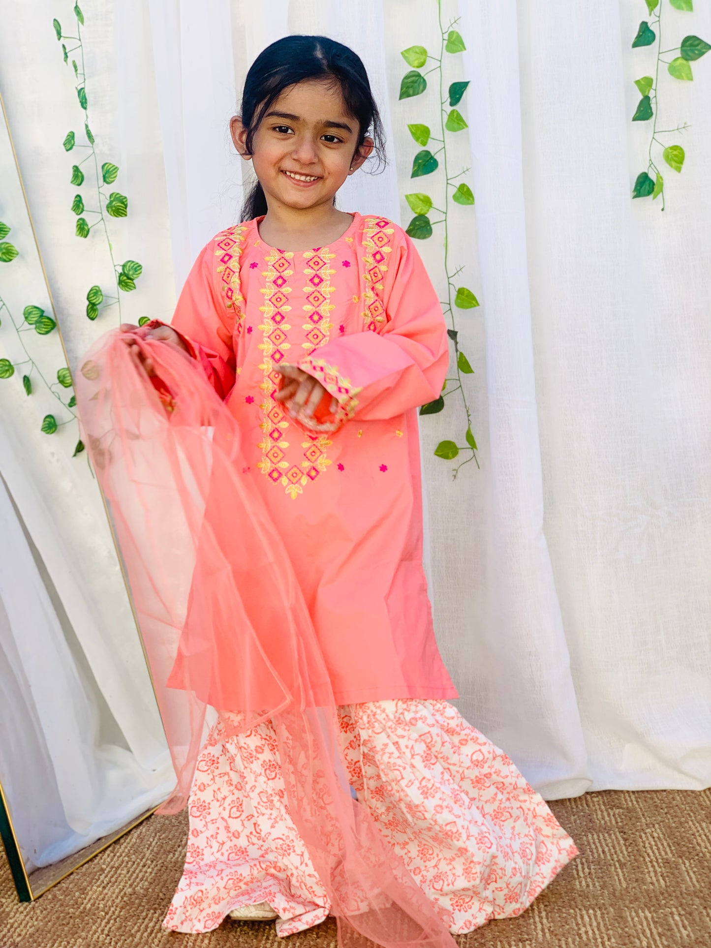 A Qaswa Embroided Orange cotton gharara 3pc dress