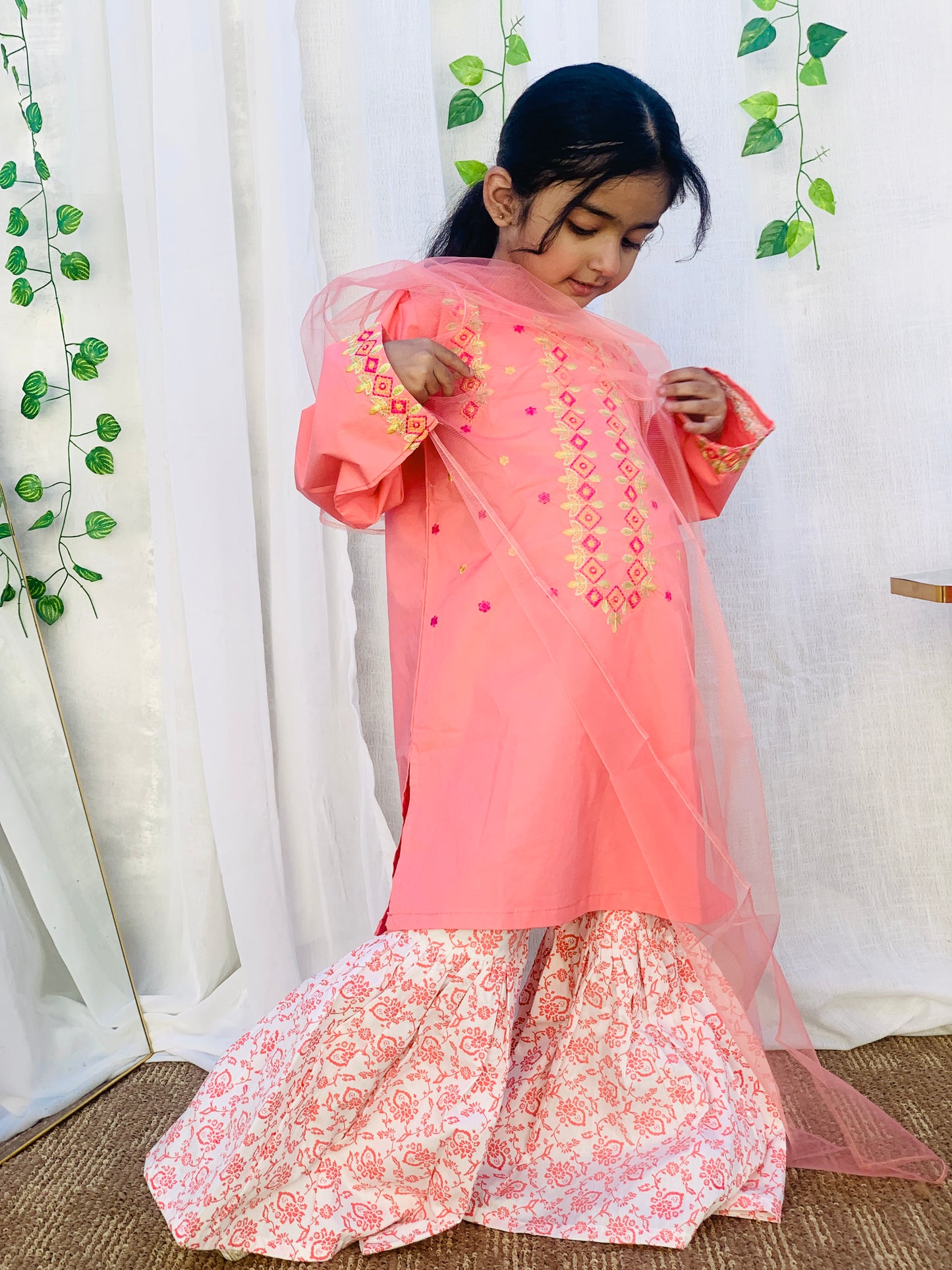 A Qaswa Embroided Orange cotton gharara 3pc dress